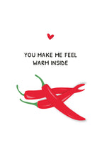 Red chili peppers with a heart and text 'You make me feel warm inside' on a white background